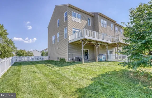a view of a building with a yard