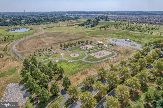 a view of a water pond with an outdoor seating