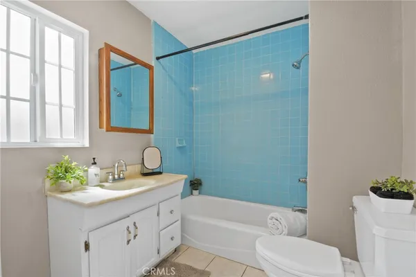 a bathroom with a sink a toilet and bathtub