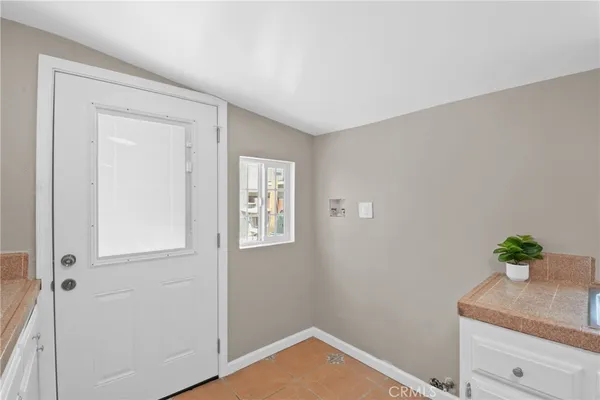 a view of an entryway with wooden floor