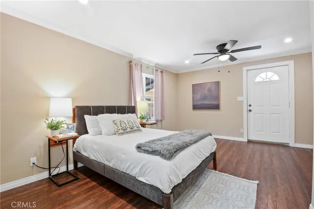 a spacious bedroom with a bed and a table