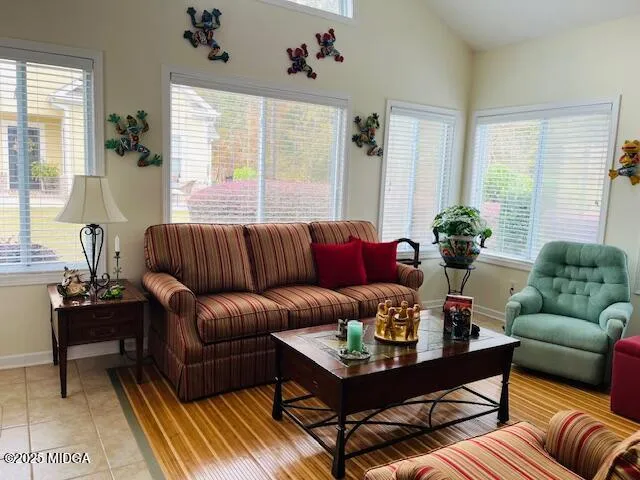 a living room with furniture and a large window