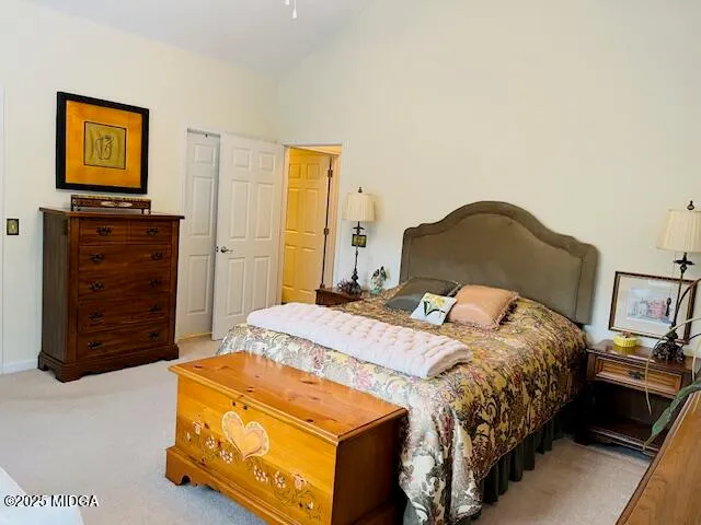 a bedroom with a bed and dresser