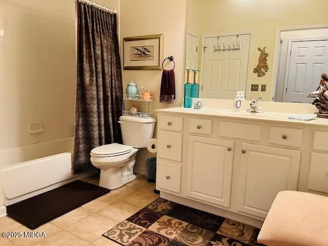 a spacious bathroom with a toilet a sink and a mirror