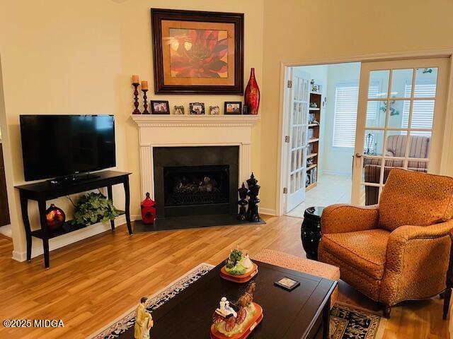 1402 Cottage Hill Drive Macon, GA 31210 - Photo 8 of 27 a living room with furniture a flat screen tv and a fireplace