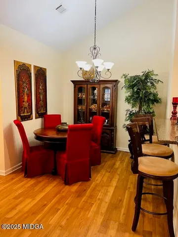 a view of a livingroom with furniture and a chandelier