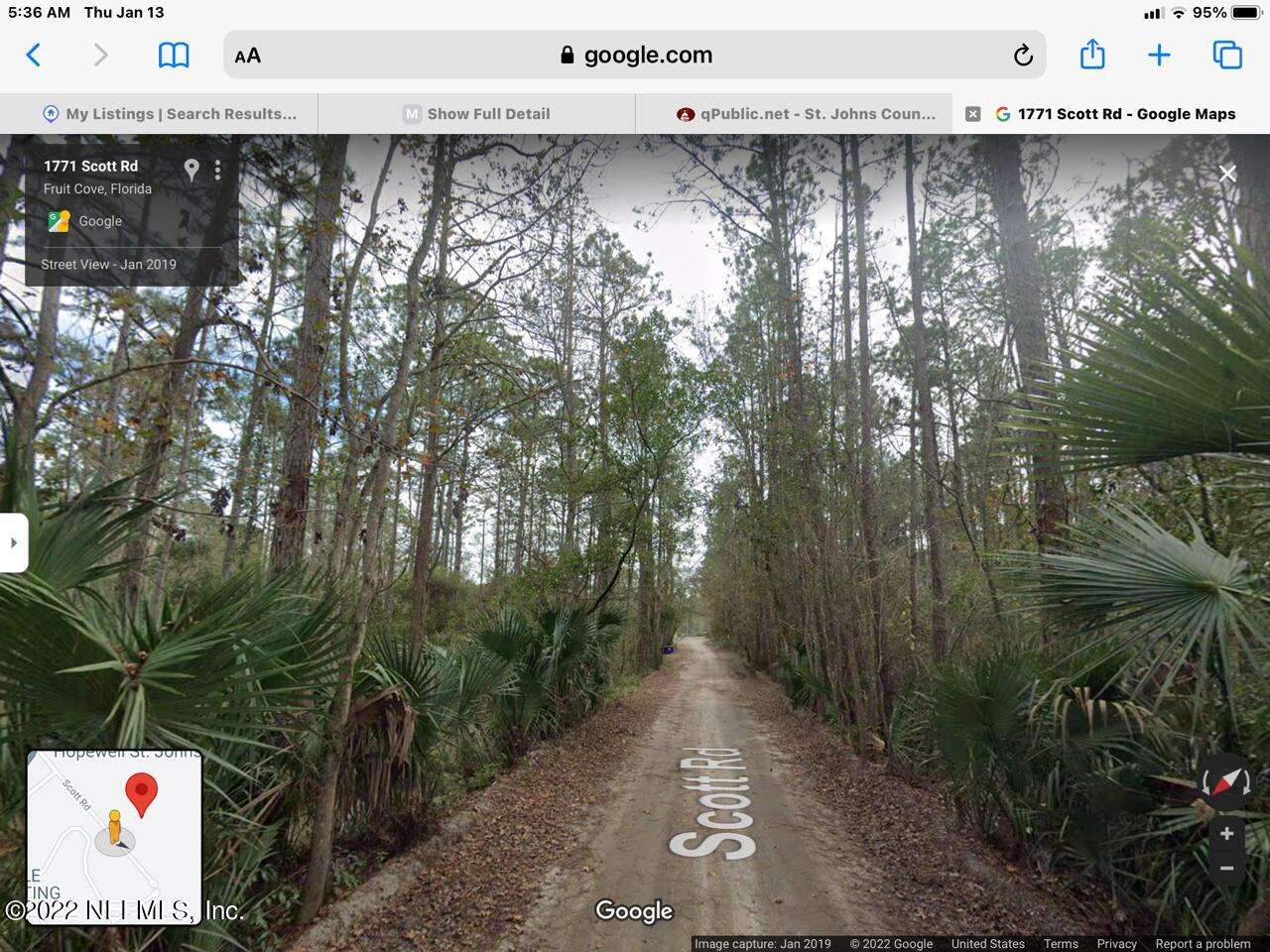 36 Scott Road St. Johns, FL 32259 - Photo 5 of 7 a view of a street with trees in front of it