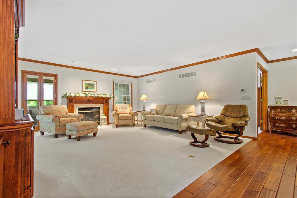 22 Barley Circle Bloomington, IL 61704 - Photo 12 of 30 a living room with furniture window and a flat screen tv