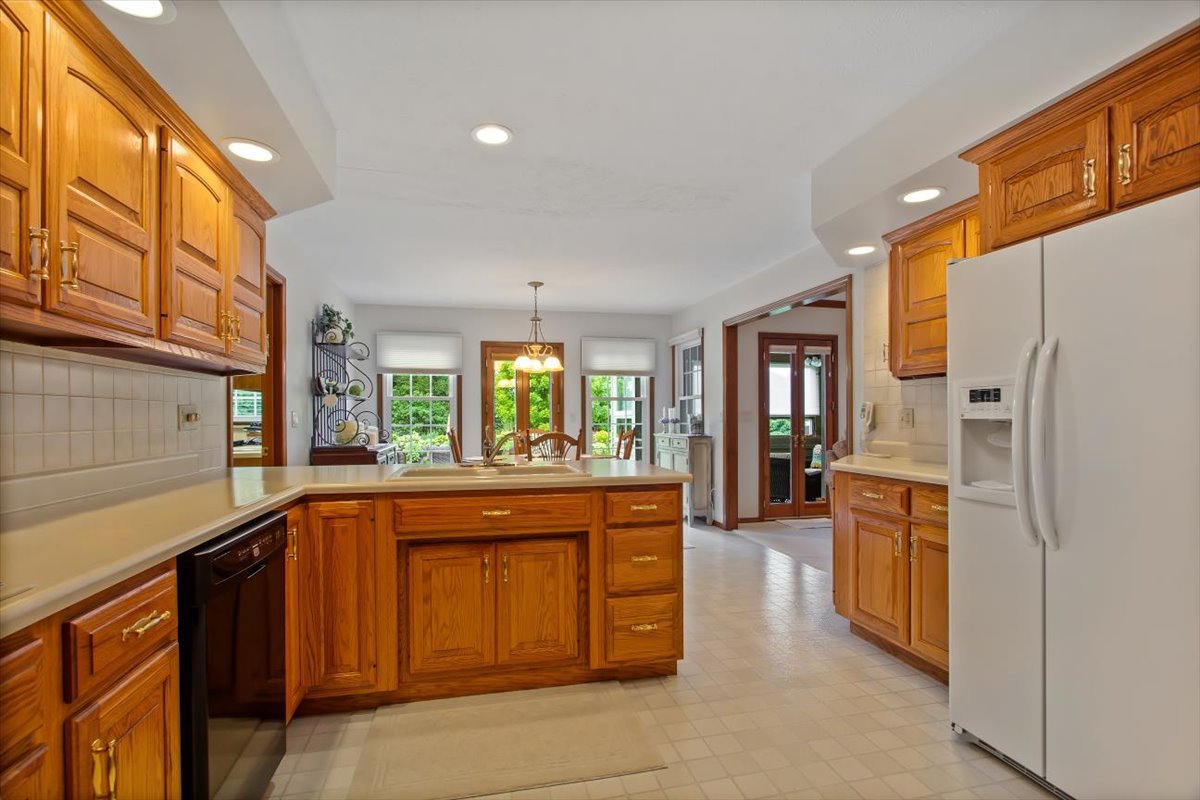 22 Barley Circle Bloomington, IL 61704 - Photo 13 of 30 a kitchen with a refrigerator and a sink