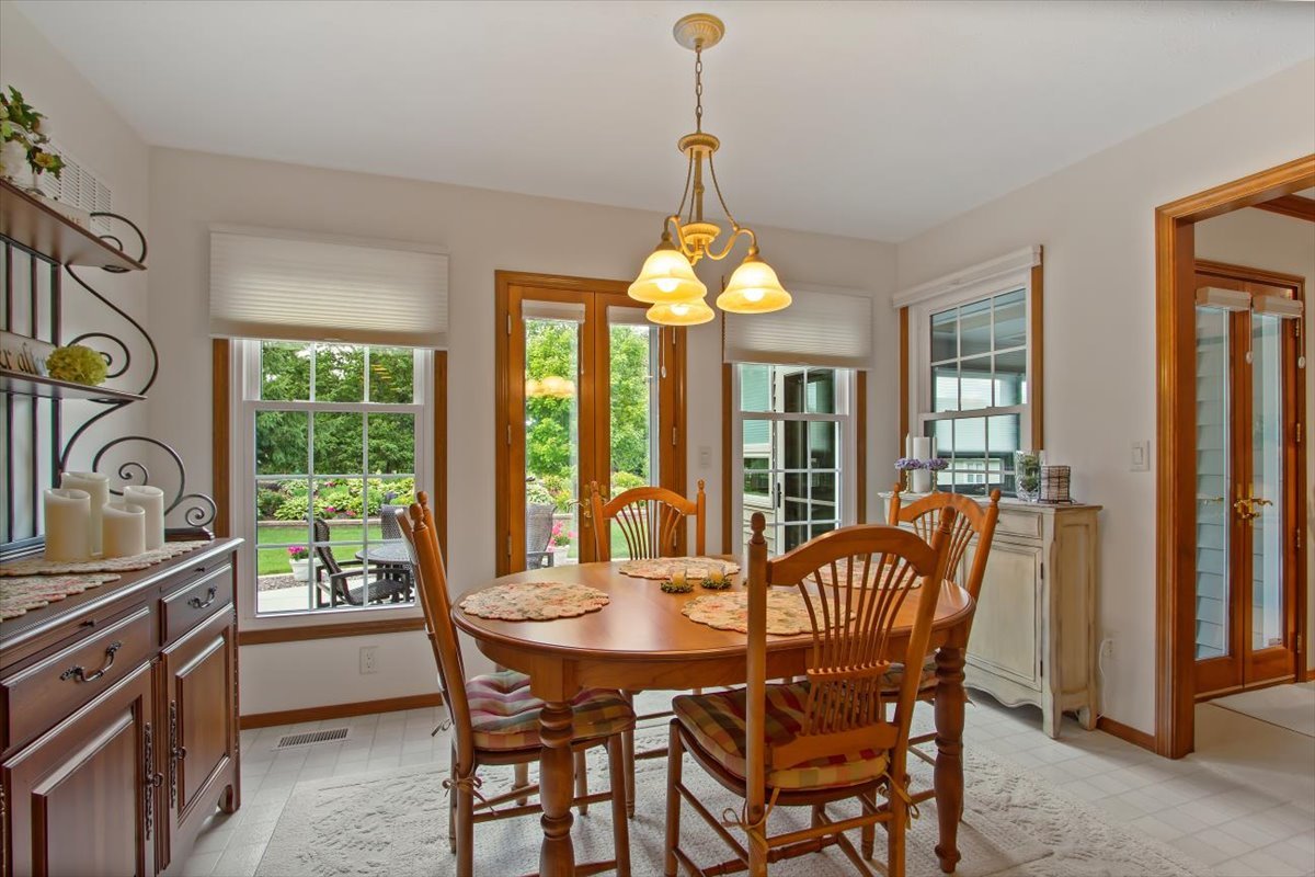 22 Barley Circle Bloomington, IL 61704 - Photo 15 of 30 a dining room with furniture a chandelier and window