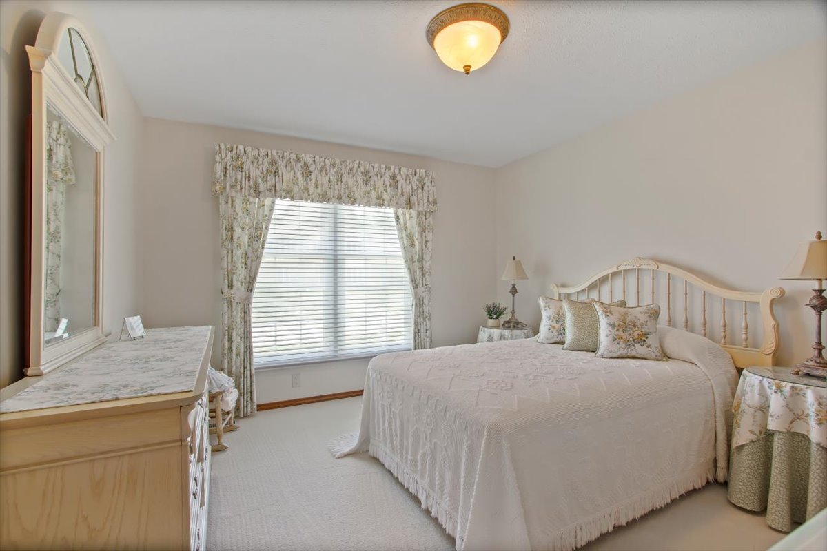22 Barley Circle Bloomington, IL 61704 - Photo 18 of 30 a bedroom with a bed and window