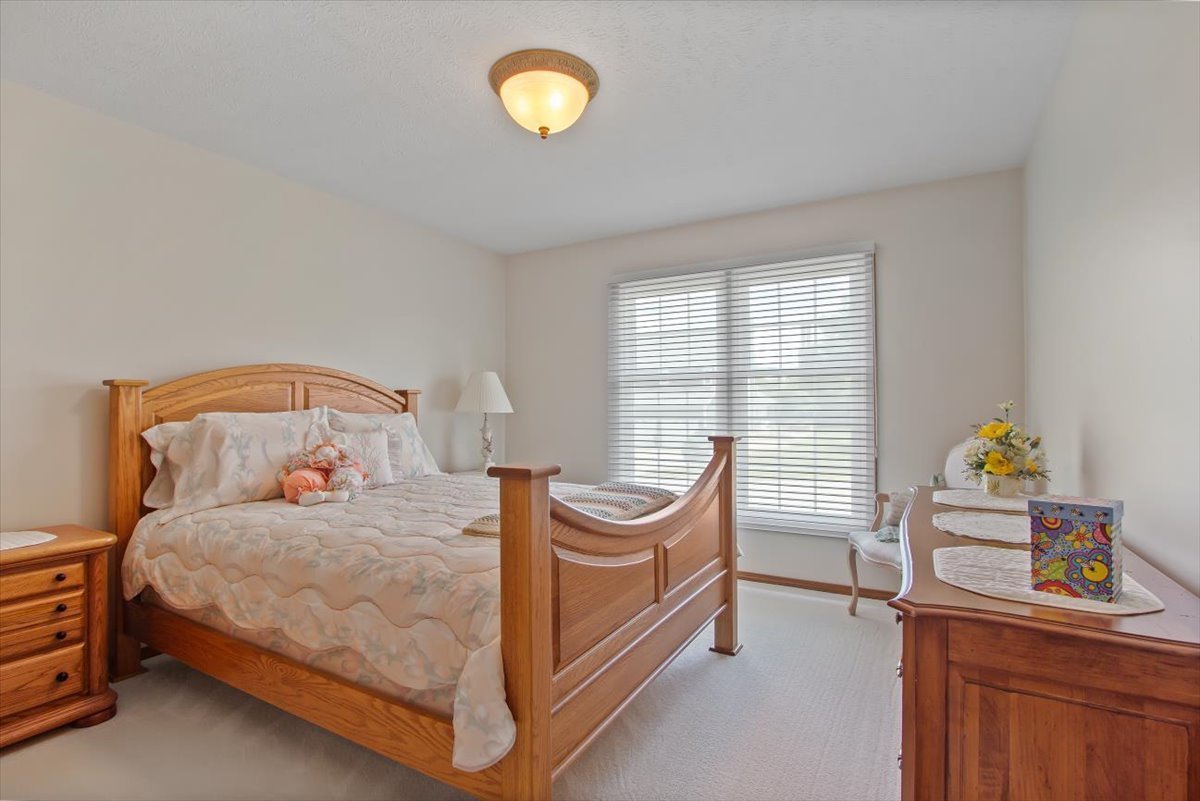 22 Barley Circle Bloomington, IL 61704 - Photo 19 of 30 a bedroom with a bed and a window