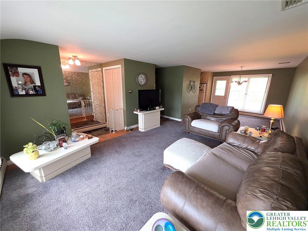 327 Sumner Avenue Whitehall, PA 18052 - Photo 14 of 38 a living room with furniture and a large window
