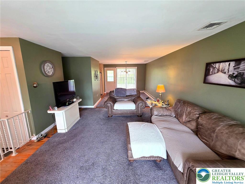 327 Sumner Avenue Whitehall, PA 18052 - Photo 15 of 38 a living room with furniture and a flat screen tv