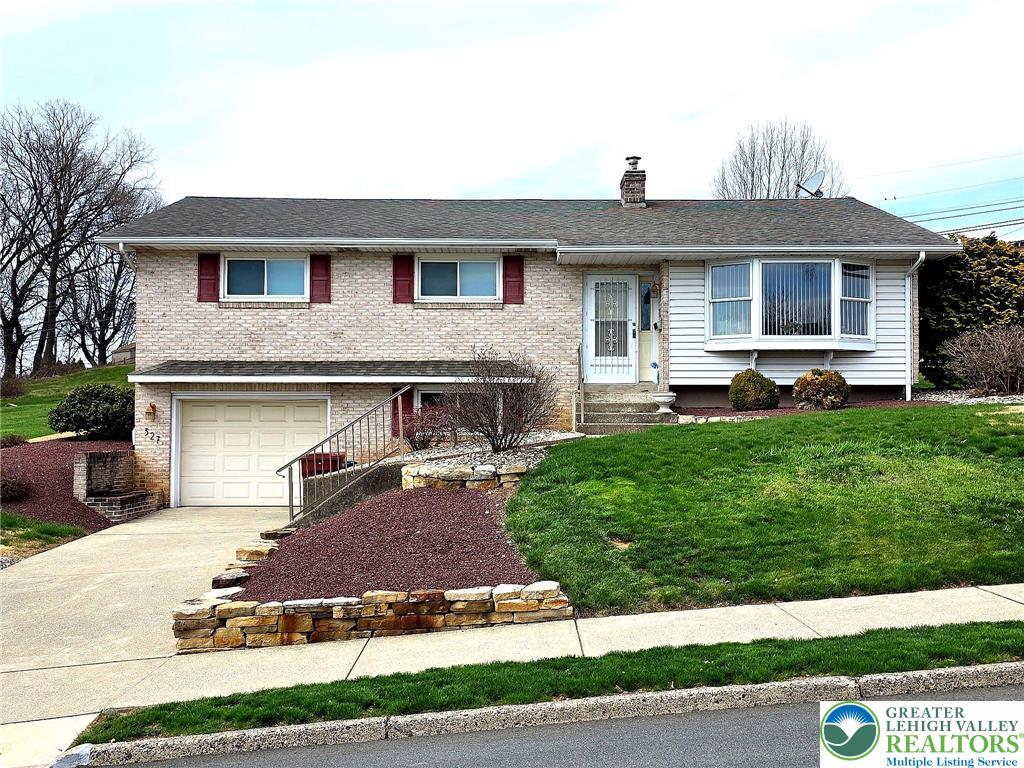 327 Sumner Avenue Whitehall, PA 18052 - Photo 2 of 38 a front view of a house with a yard