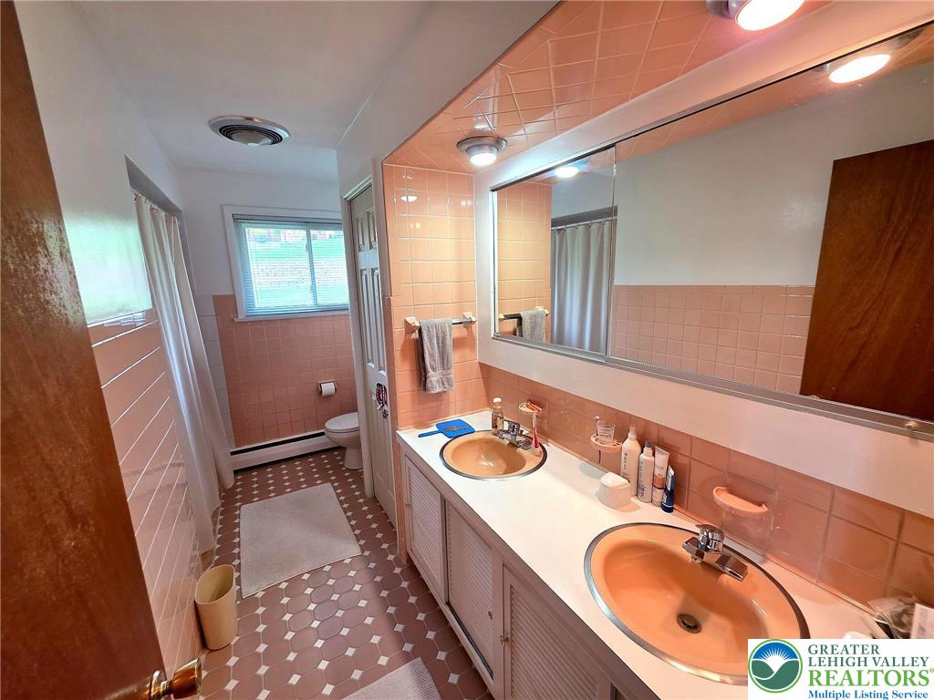 327 Sumner Avenue Whitehall, PA 18052 - Photo 25 of 38 a bathroom with a sink double vanity