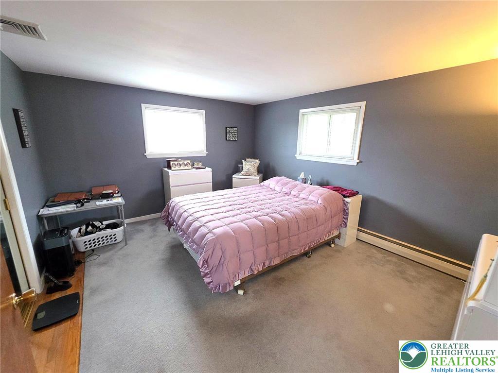 327 Sumner Avenue Whitehall, PA 18052 - Photo 26 of 38 a bedroom with a bed and a window
