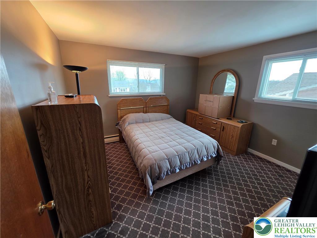 327 Sumner Avenue Whitehall, PA 18052 - Photo 30 of 38 a bedroom with a bed and window