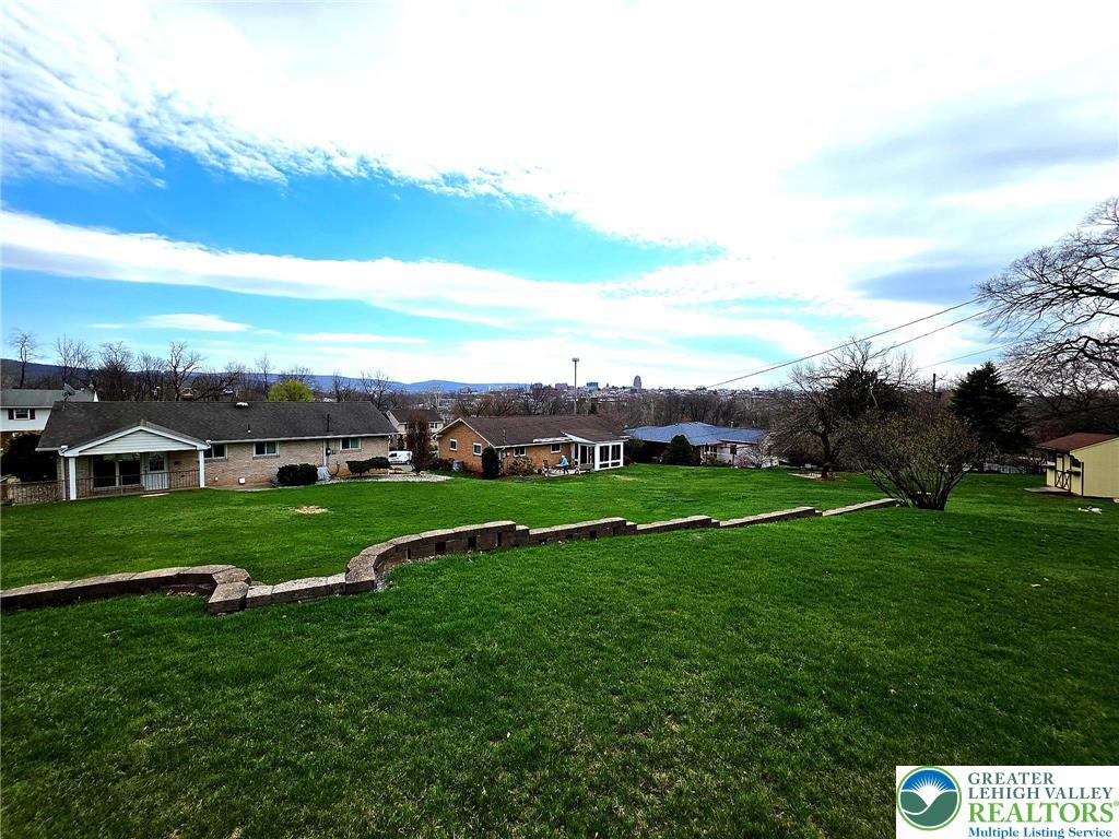 327 Sumner Avenue Whitehall, PA 18052 - Photo 5 of 38 a view of grassy field with house