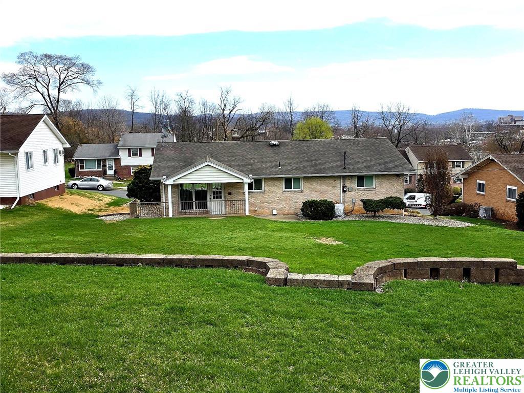 327 Sumner Avenue Whitehall, PA 18052 - Photo 6 of 38 a aerial view of a house with a big yard