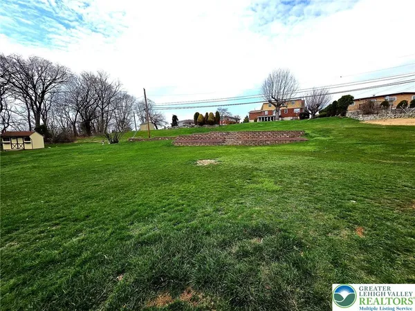 a view of yard with outdoor seating and green space