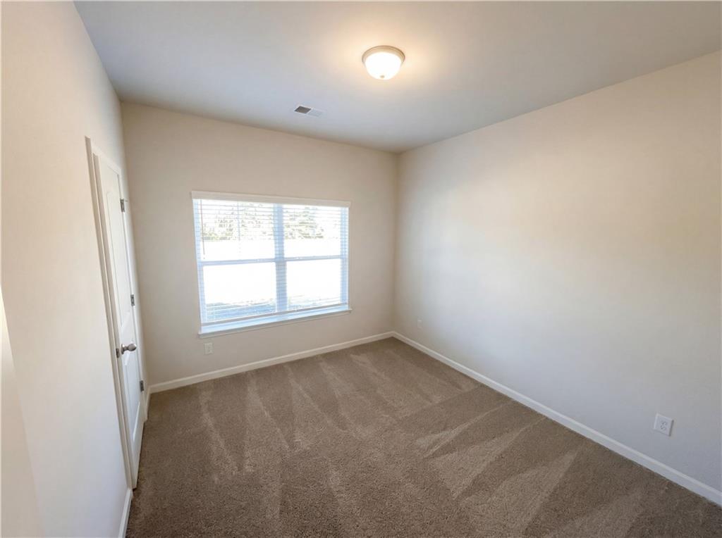 104 Charlie Fuller Road Grantville, GA 30220 - Photo 14 of 19 an empty room with a window