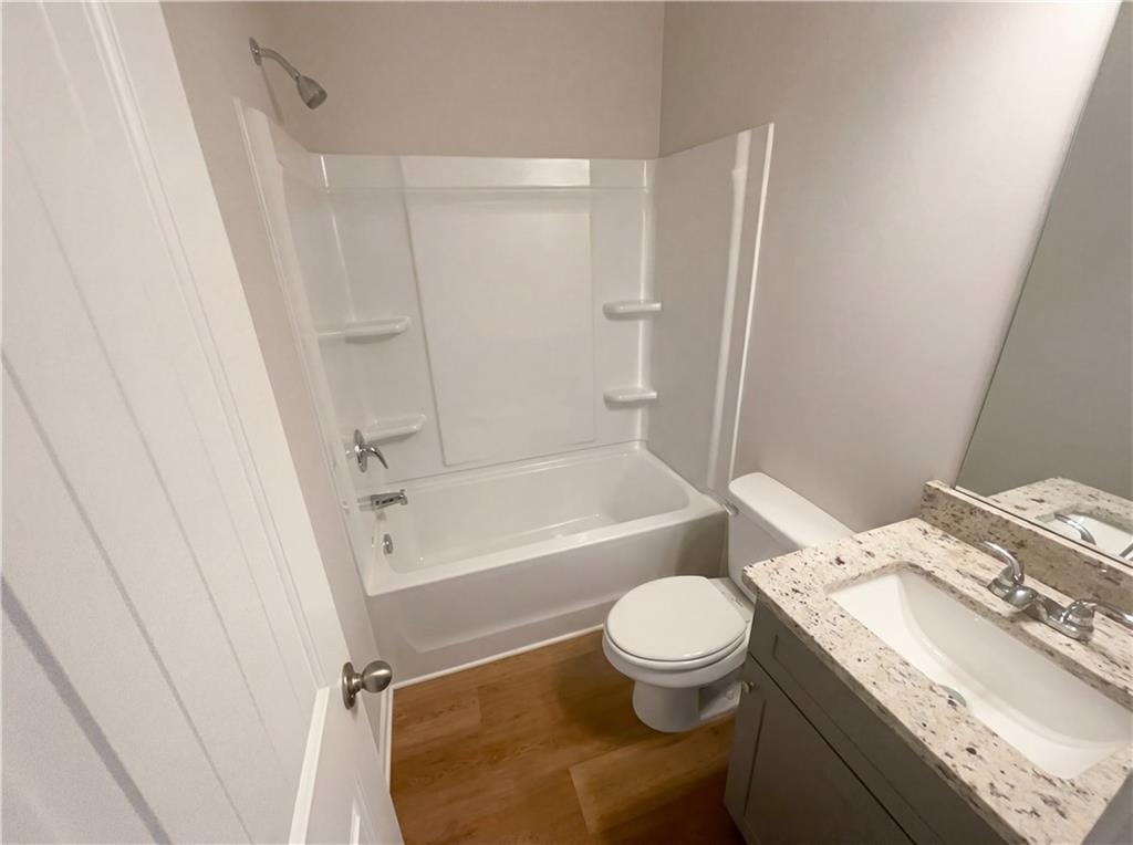 104 Charlie Fuller Road Grantville, GA 30220 - Photo 15 of 19 a white toilet sitting next to a bath tub