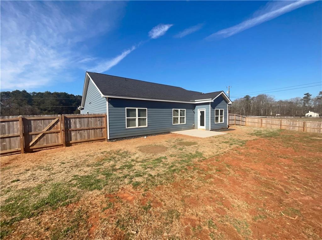 104 Charlie Fuller Road Grantville, GA 30220 - Photo 5 of 19 a house with trees in front of it