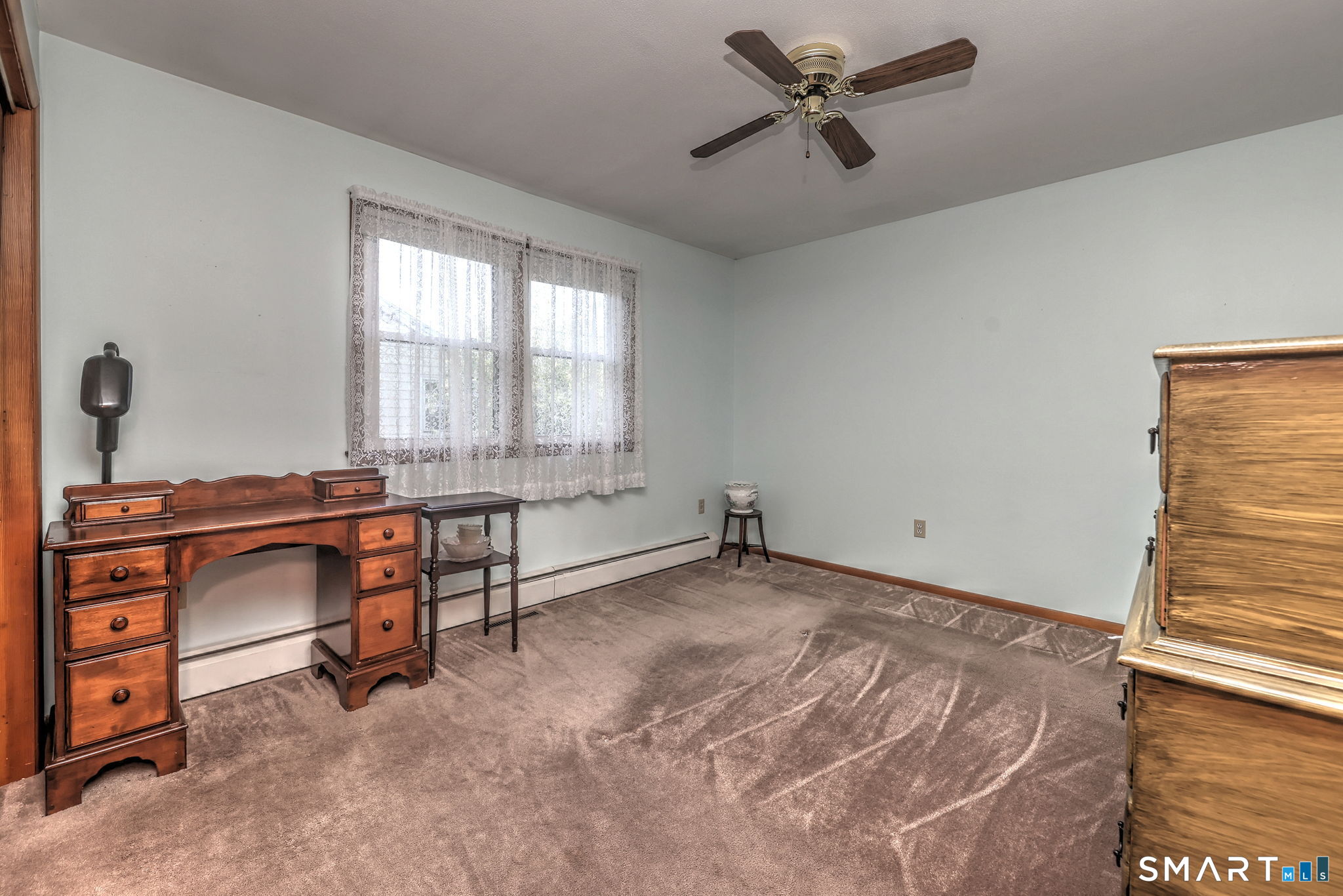 212 Swain Avenue Meriden, CT 06450 - Photo 22 of 38 a view of a workspace with furniture and a window