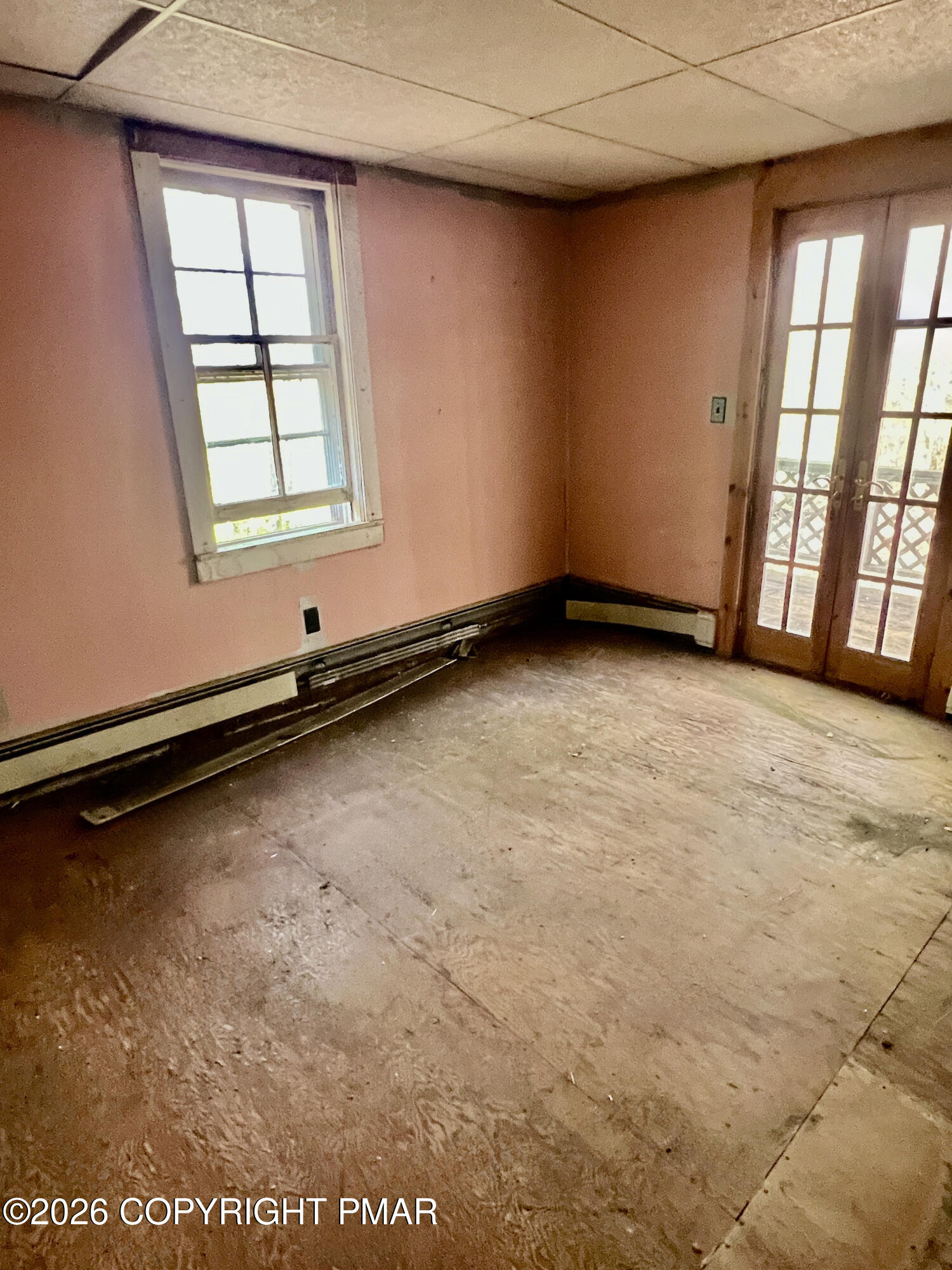 1214 Sugar Mountain Road West Bushkill, PA 18324 - Photo 9 of 9 an empty room with windows