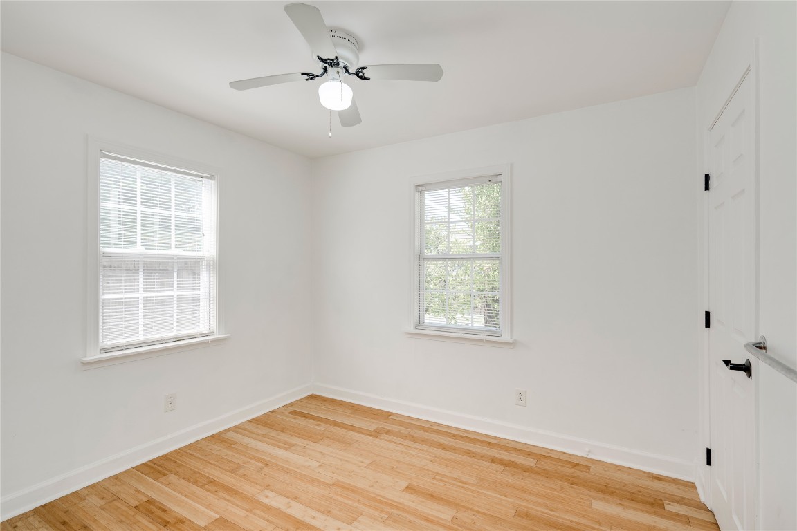 2903 South 5th Street Austin, TX 78704 - Photo 11 of 39 a view of an empty room with a window and wooden floor
