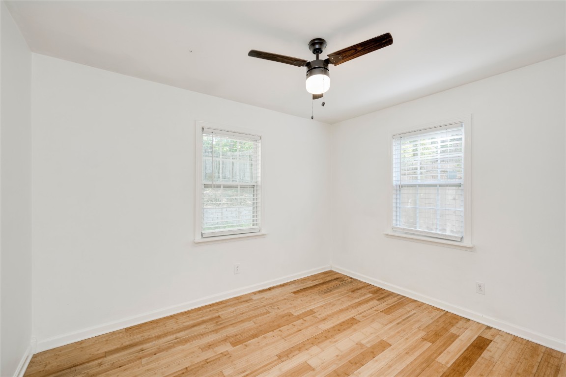 2903 South 5th Street Austin, TX 78704 - Photo 14 of 39 a view of empty room with wooden floor and fan