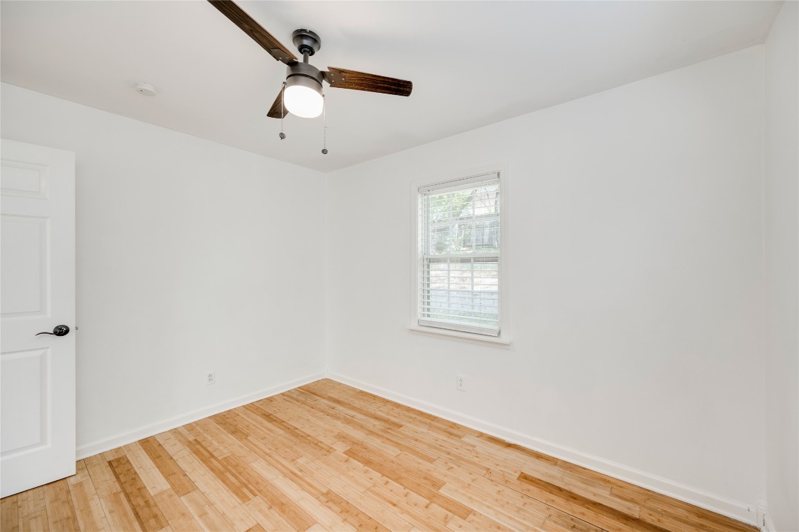 2903 South 5th Street Austin, TX 78704 - Photo 16 of 39 an empty room with a window and a ceiling fan