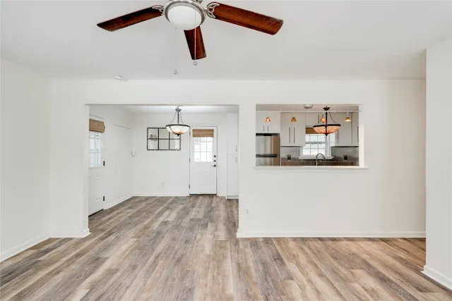 a view of a kitchen with wooden floor