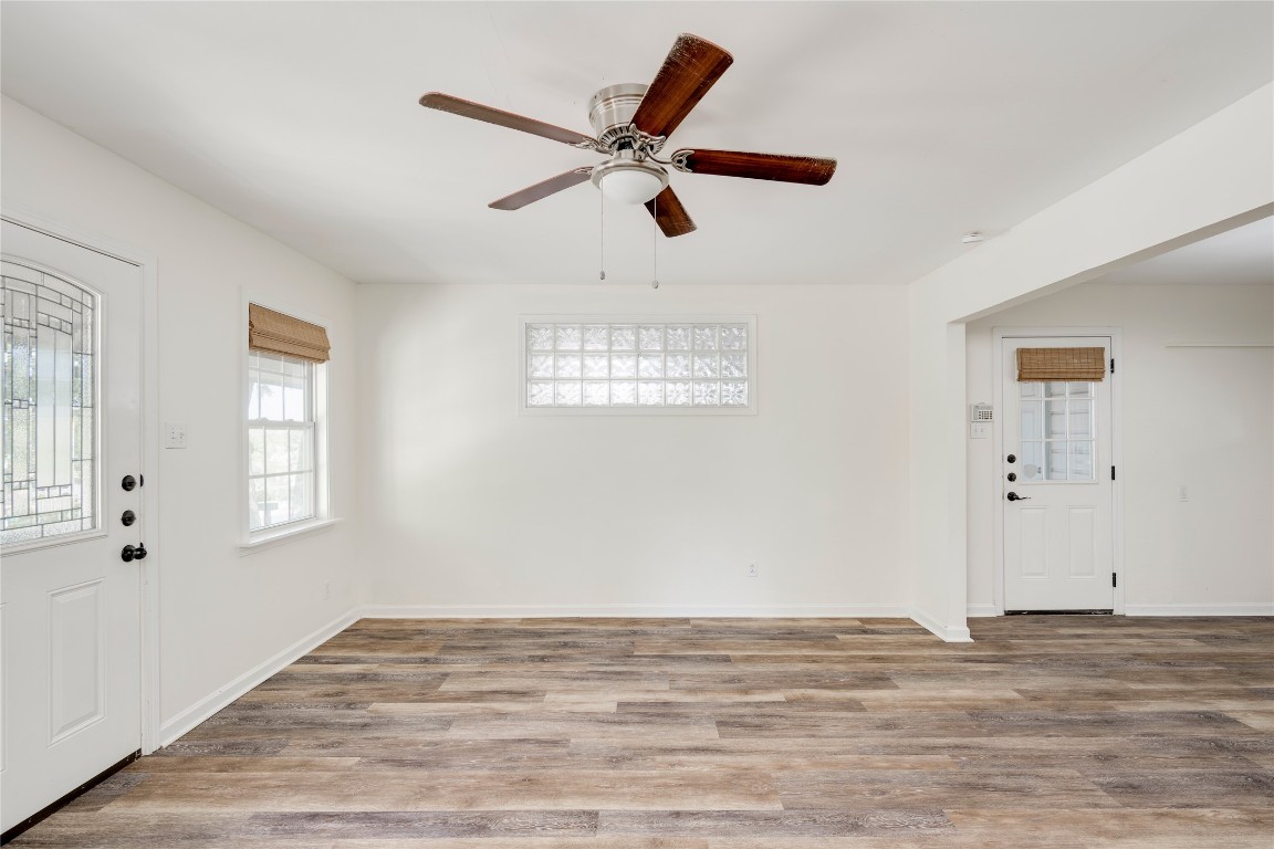 2903 South 5th Street Austin, TX 78704 - Photo 22 of 39 a view of empty room with wooden floor and window