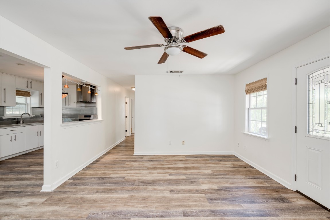 2903 South 5th Street Austin, TX 78704 - Photo 24 of 39 a view of a livingroom with wooden floor and a ceiling fan