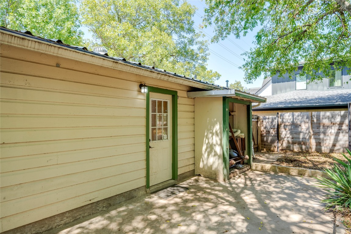 2903 South 5th Street Austin, TX 78704 - Photo 35 of 39 a view of a porch with wooden walls and a large tree