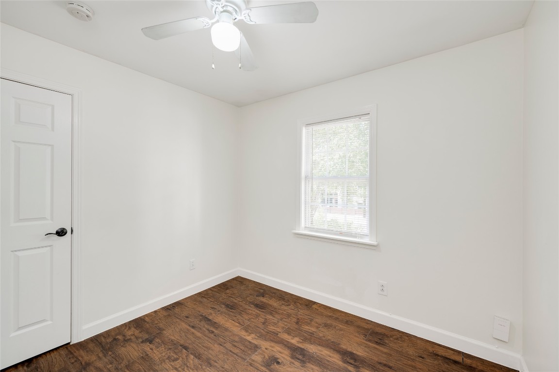 2903 South 5th Street Austin, TX 78704 - Photo 9 of 39 an empty room with wooden floor and windows