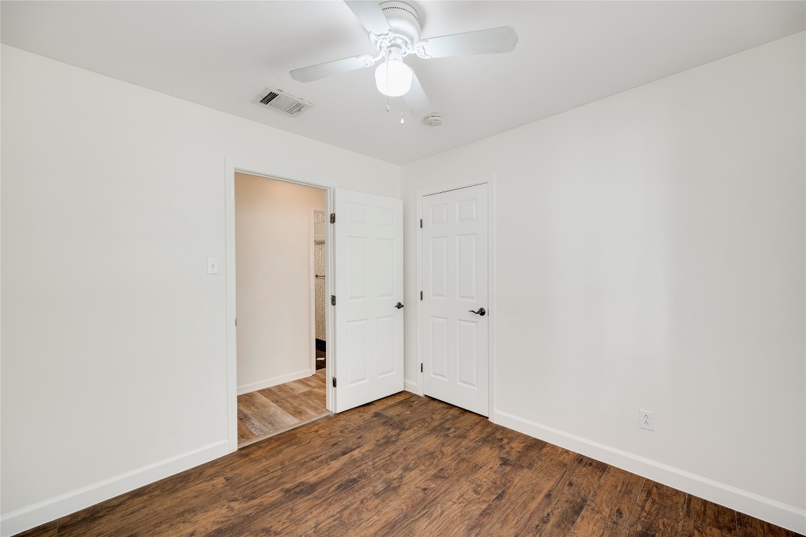 2903 South 5th Street Austin, TX 78704 - Photo 10 of 39 an empty room with wooden floor and fan