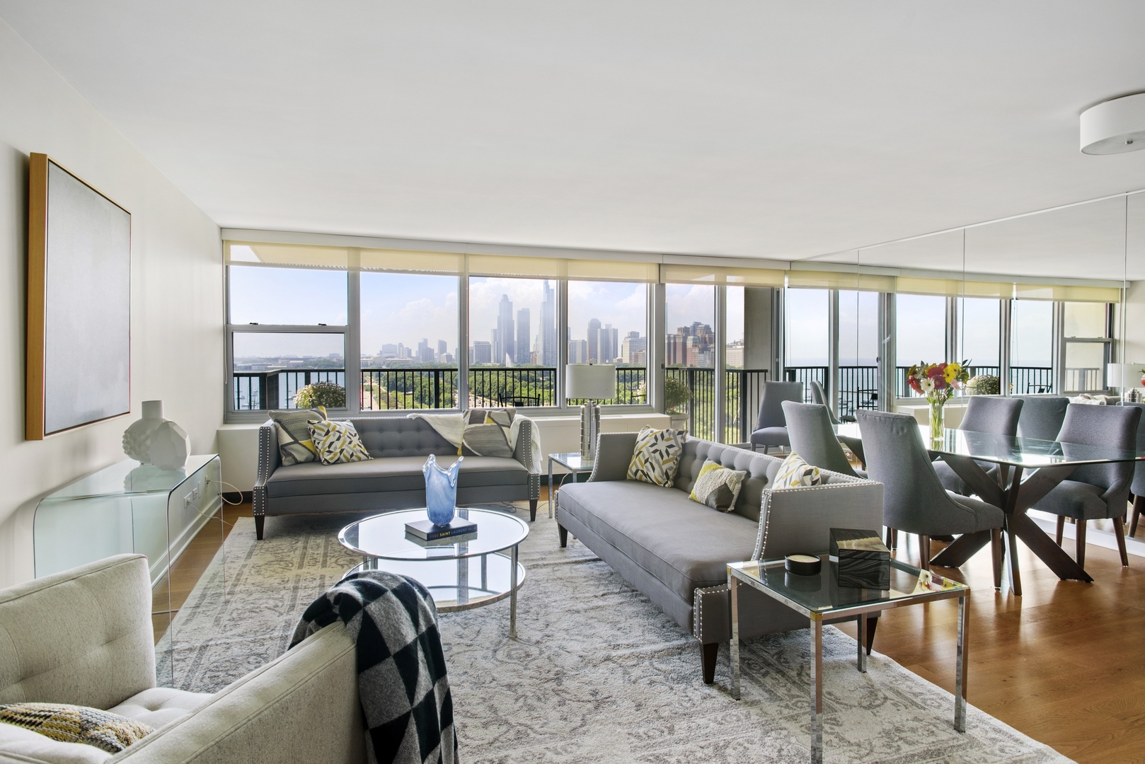 400 East Randolph Street, Unit 1403 Chicago, IL 60601 - Photo 2 of 17 a living room with furniture and a large window