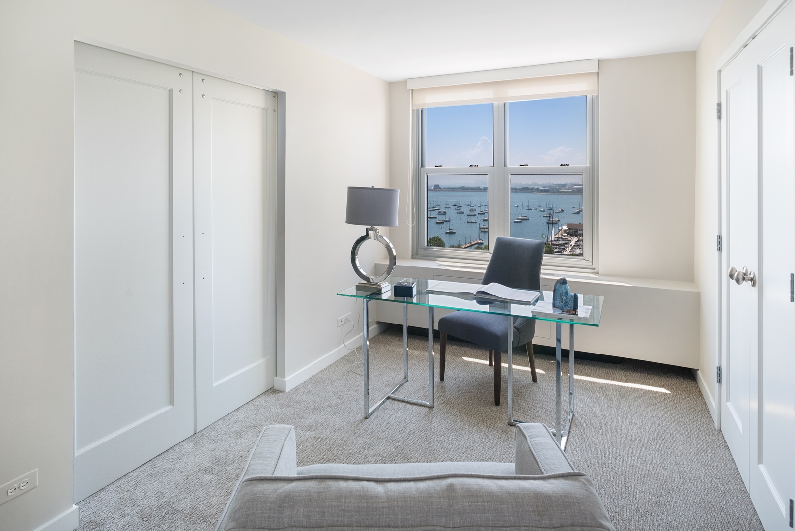 400 East Randolph Street, Unit 1403 Chicago, IL 60601 - Photo 11 of 17 a work room with furniture and a window