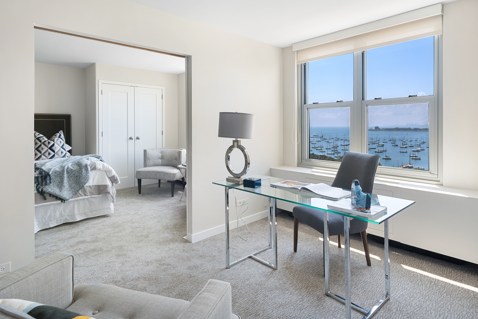 400 East Randolph Street, Unit 1403 Chicago, IL 60601 - Photo 12 of 17 a view of a workspace with furniture and a window