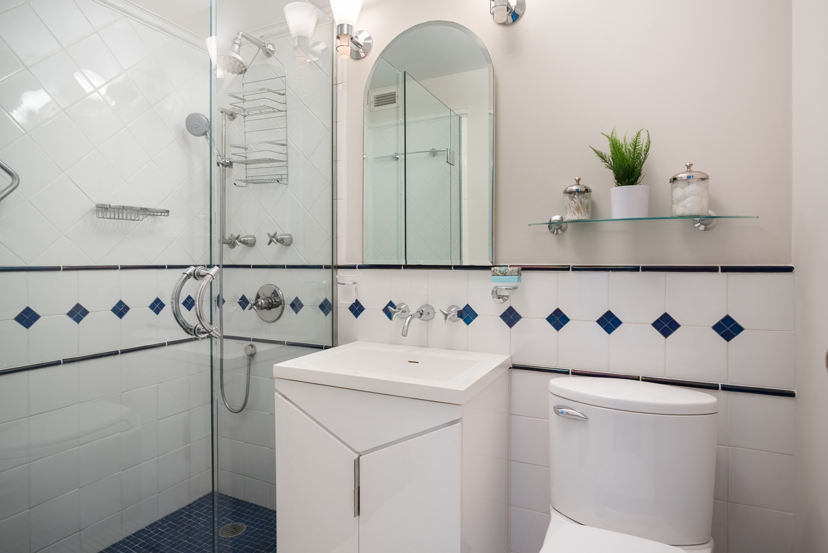 400 East Randolph Street, Unit 1403 Chicago, IL 60601 - Photo 13 of 17 a bathroom with a sink and a mirror