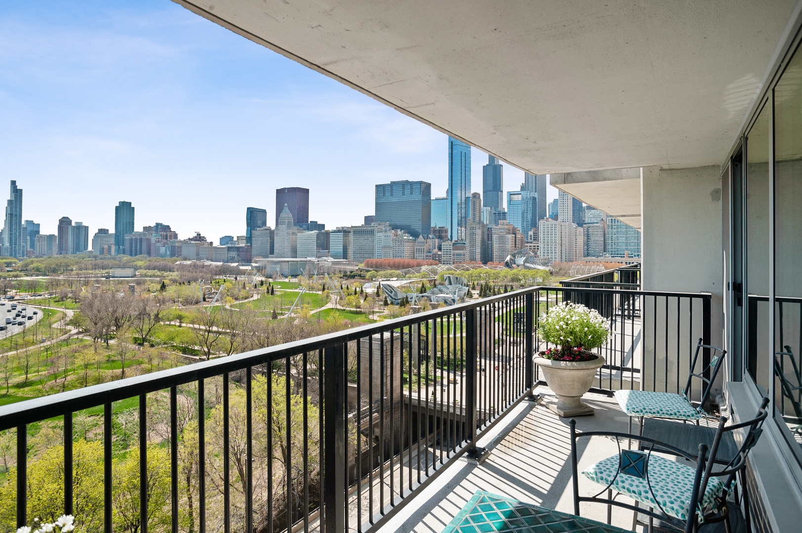 400 East Randolph Street, Unit 1403 Chicago, IL 60601 - Photo 15 of 17 a view of a city from a balcony with outdoor seating