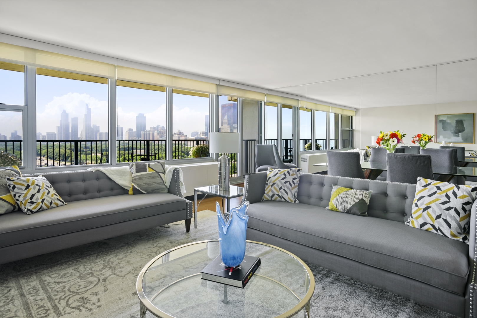 400 East Randolph Street, Unit 1403 Chicago, IL 60601 - Photo 3 of 17 a living room with furniture and a large window