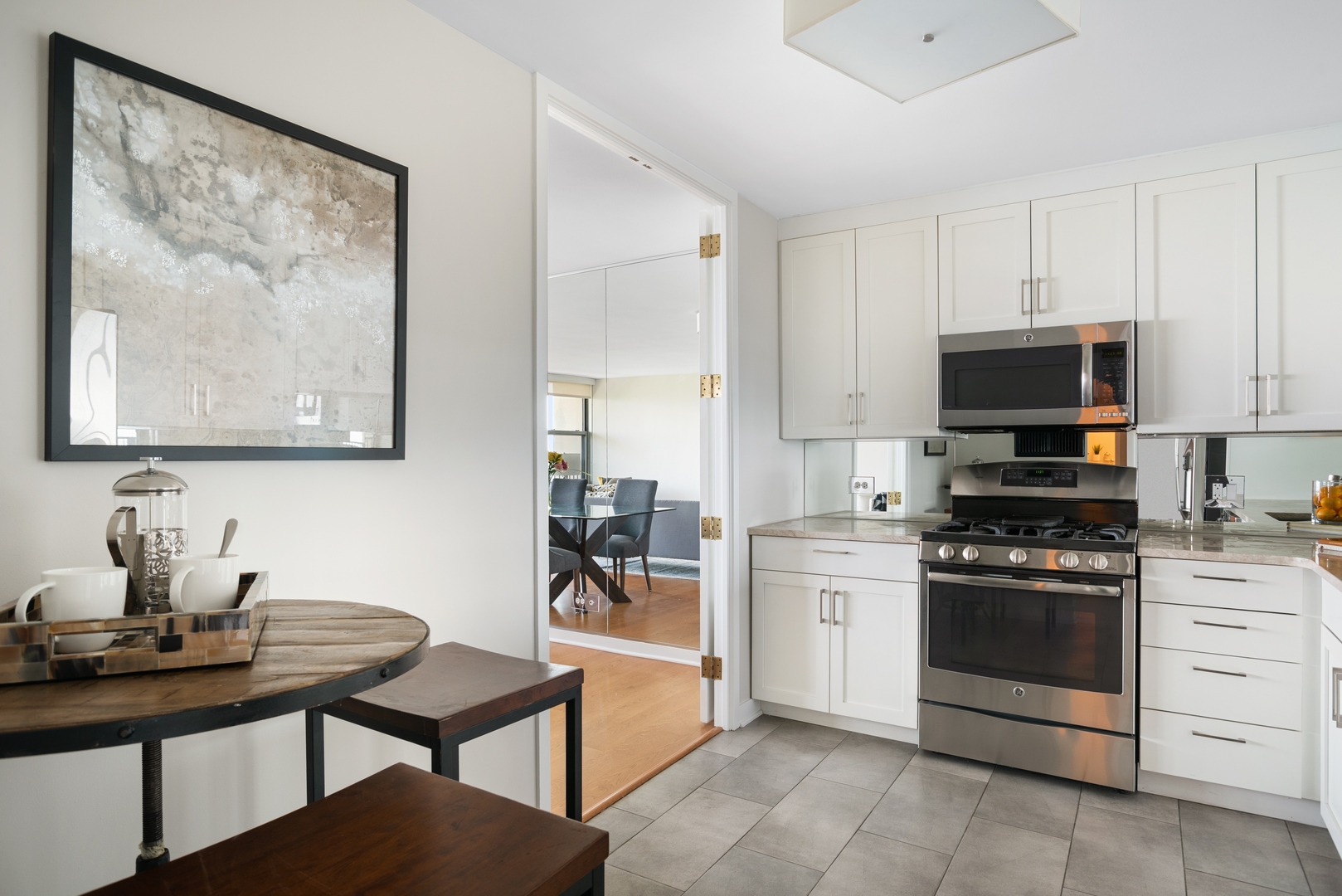 400 East Randolph Street, Unit 1403 Chicago, IL 60601 - Photo 7 of 17 a kitchen with stainless steel appliances a stove top oven
