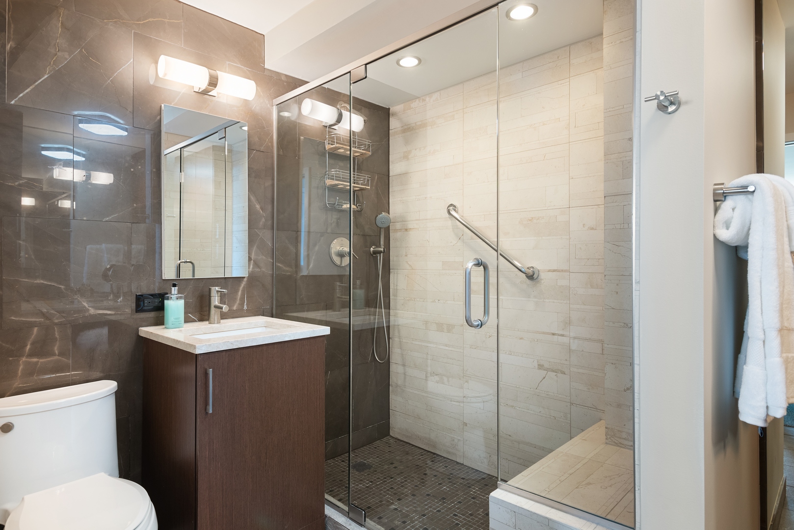 400 East Randolph Street, Unit 1403 Chicago, IL 60601 - Photo 10 of 17 a bathroom with a shower sink mirror and toilet