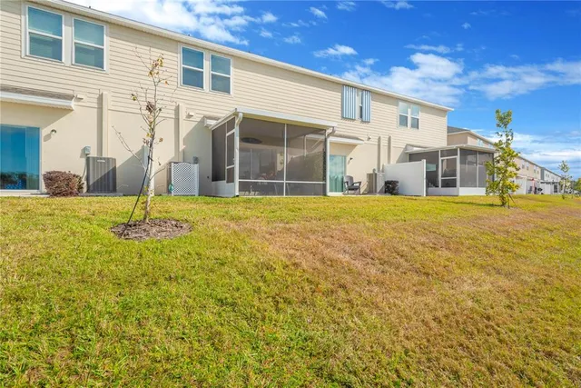 a view of yellow house with a outdoor space