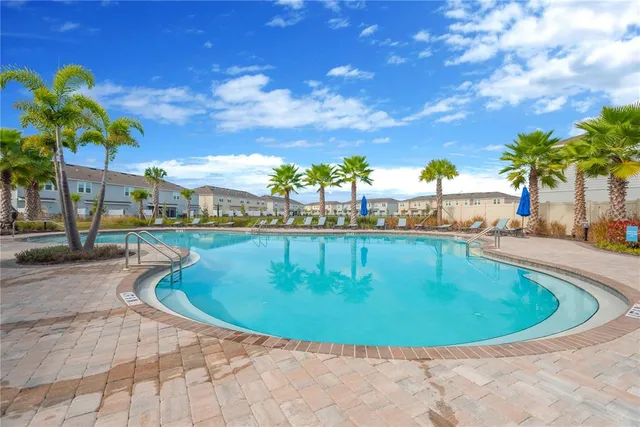 a view of a swimming pool with a garden