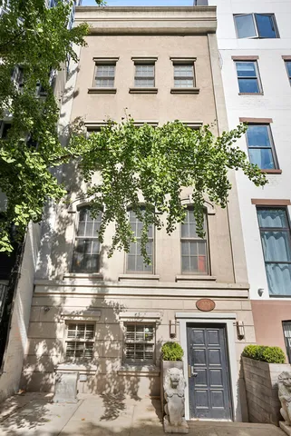 a living room with furniture fireplace and a large window